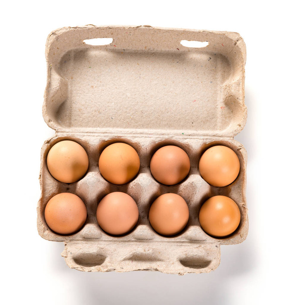 top view fresh eggs in a paper package - Фото, зображення