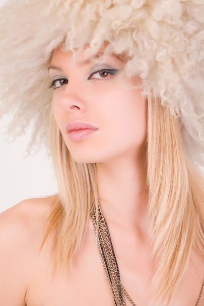 Portrait of beautiful girl in furry hat - Foto, Imagen