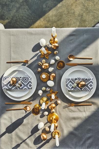 top view of easter eggs and candles on festive table in restaurant - Photo, Image