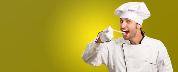 Портрет шеф кухаря їсть хліб липкий
 - Фото, зображення