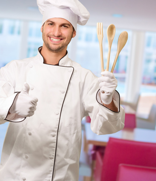 Chef Holding Wooden Spoons With Thumbs Up - Φωτογραφία, εικόνα
