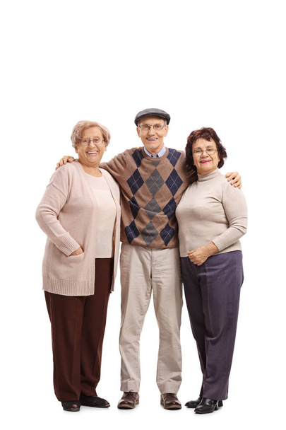 Full length portrait of an elderly man with two elderly women looking at the camera and smiling isolated on white background - Foto, Imagen