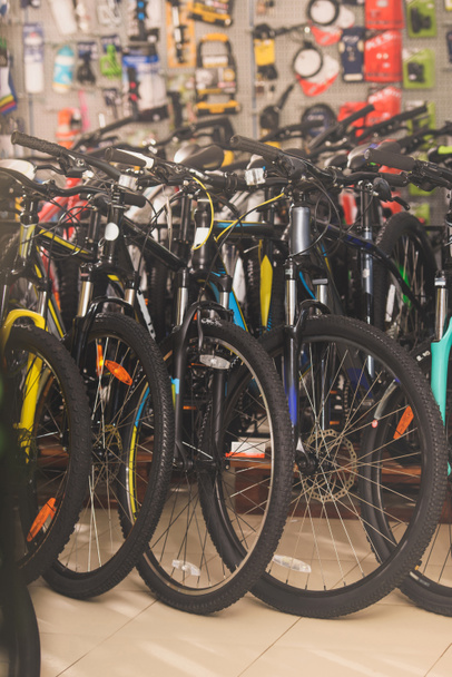 various bicycles displayed in bicycle shop - Foto, Imagen