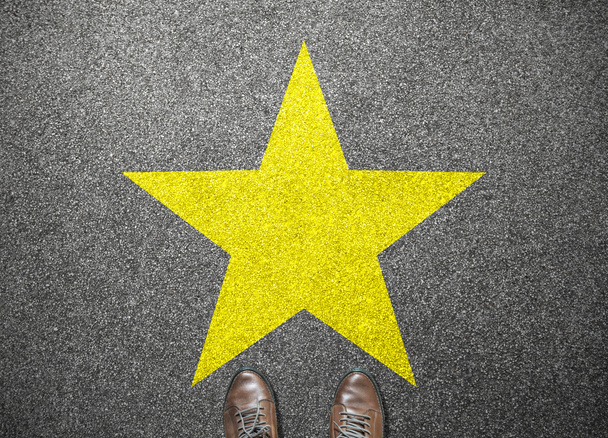 big yellow star on floor with businessman shoes - Photo, Image