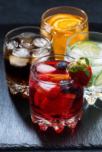 iced fruit drinks on a dark background, vertical, closeup - Foto, Imagem