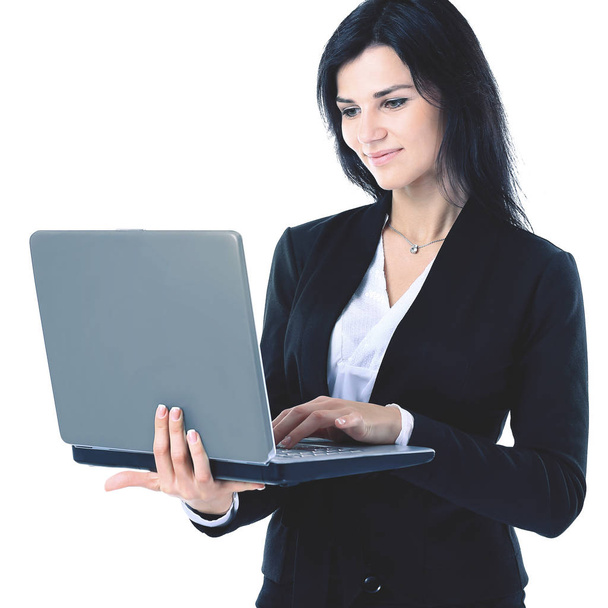 Businesswoman working at a laptop full length isolated, white background - Fotoğraf, Görsel
