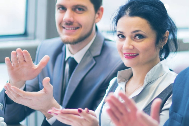 Close-up of business people clapping hands - Foto, imagen