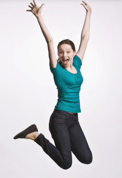 Teenage girl jumping in mid-air - Zdjęcie, obraz