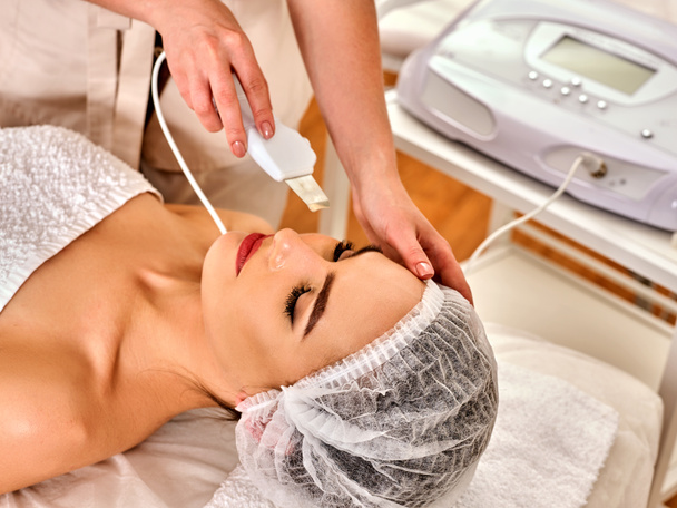 Skin care of ultrasound facial peeling. Ultrasonic cleansing procedure. - Photo, Image