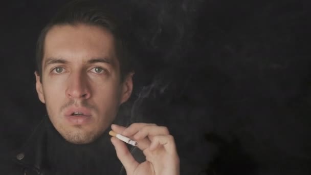 Portrait of man smokes a cigarette and coughs. Diseases from bad habits - Footage, Video