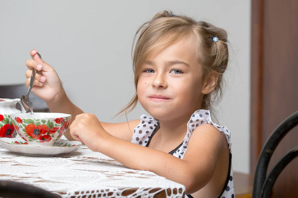 Little girl is drinking tea - Photo, image