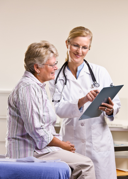 Doctor explaining medical chart to senior woman - Photo, Image