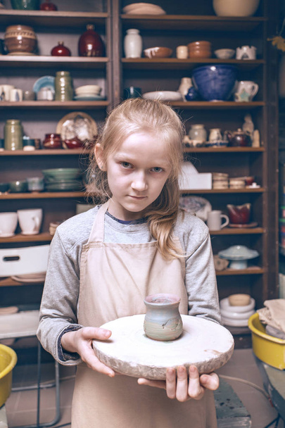 girl in a pottery workshop  - Фото, зображення