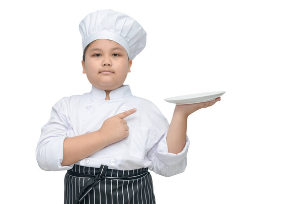 chef holding plate and pointing on it.  - Photo, Image