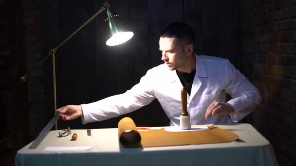 leather craftsman working making products at table in workshop studio - Felvétel, videó