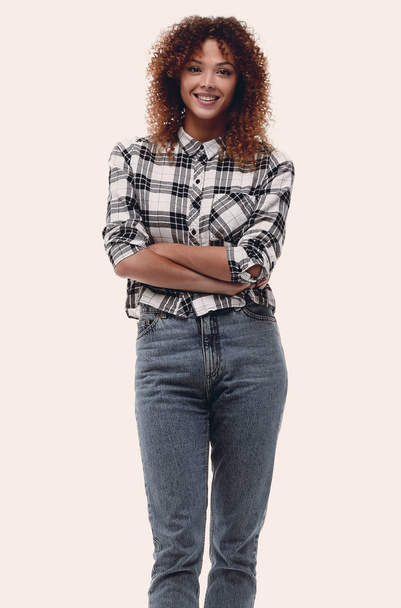 confident young woman in plaid shirt - Фото, зображення