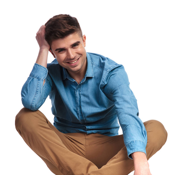 happy young casual man relaxing while sitting  - Photo, Image