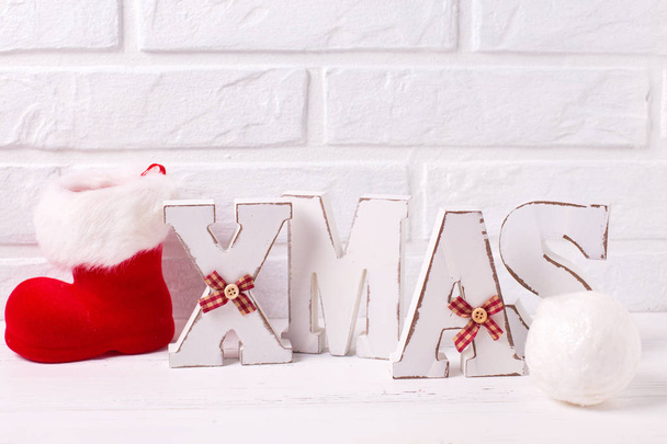 Word Xmas made from wooden letters on white wooden background. Place for text. - Фото, зображення