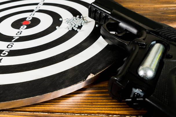 Air gun  and a target on the table - Photo, Image