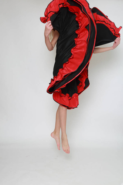 Studio image of flamenco dancer is jumping/Dancer in motion - Foto, Imagen