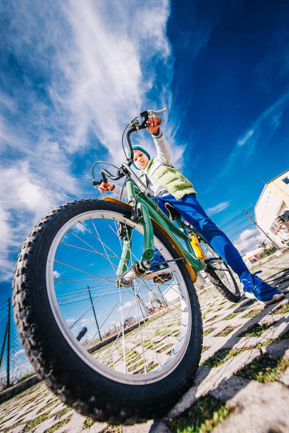 Close-Up of Bicycle Wheel with Kid on Sunny Day at Spring  - Photo, Image