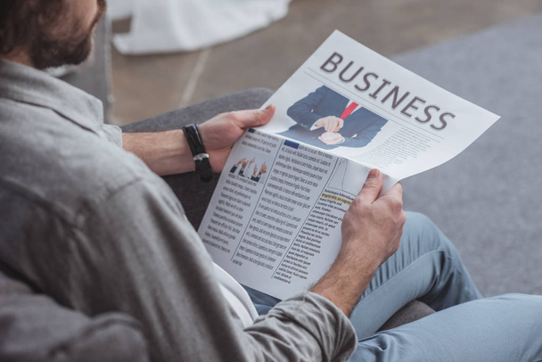 cropped image of man reading business newspaper at home - Fotografie, Obrázek