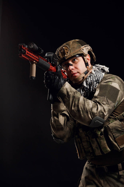 Portrait of aiming soldier with gun - Φωτογραφία, εικόνα