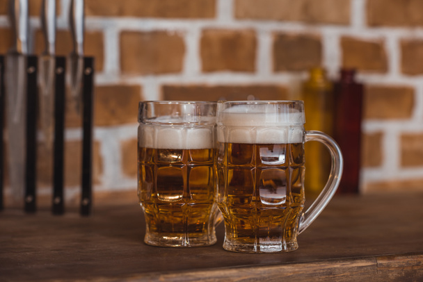 two glasses of beer on kitchen counter - 写真・画像