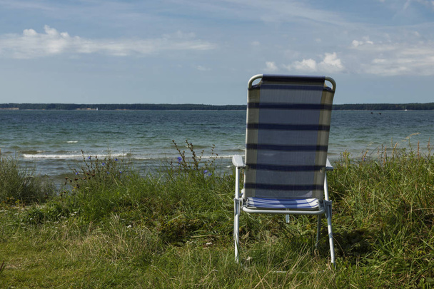 The solitude of the chair at the beach - Fotó, kép