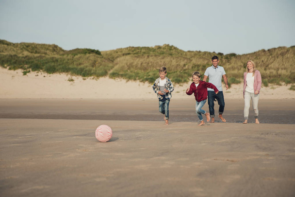 Playing Football on the Beach - Foto, Bild