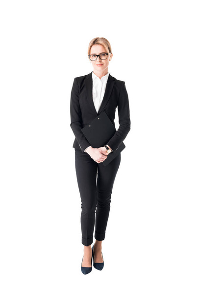 Уверенная деловая женщина в черном костюме изолирована на белом
 - Фото, изображение