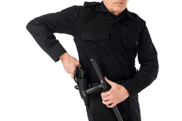 Close-up view of policeman in uniform pulling out gun isolated on white - Fotografie, Obrázek