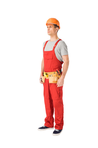 Handsome builder in uniform with tool belt isolated on white - Zdjęcie, obraz