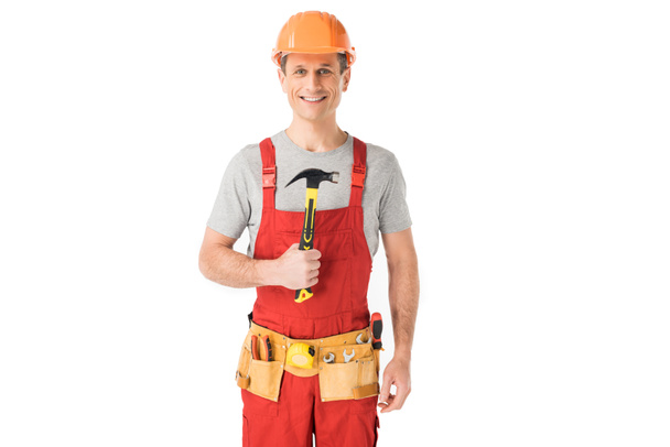 Веселый строитель держит молоток изолированный на белом
 - Фото, изображение