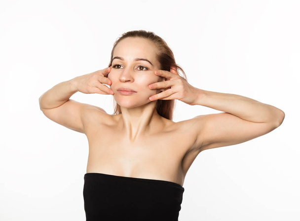 woman doing face fitness, aging chang in the muscles of the face. beauty and health concept - Photo, Image