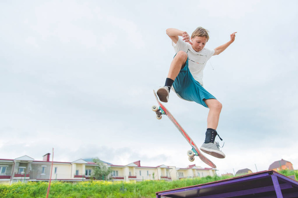 Young skateboarder in a jump - Photo, Image