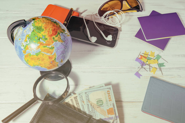 Travel concept. Globe, money preparing for a trip - Photo, Image