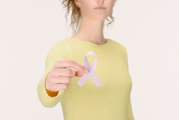 cropped shot of woman showing Breast cancer awareness ribbon in hand isolated on white - Fotografie, Obrázek
