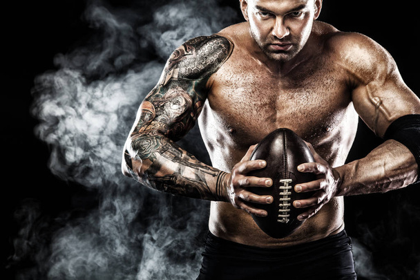 American football sportsman player isolated on black background - Fotografie, Obrázek