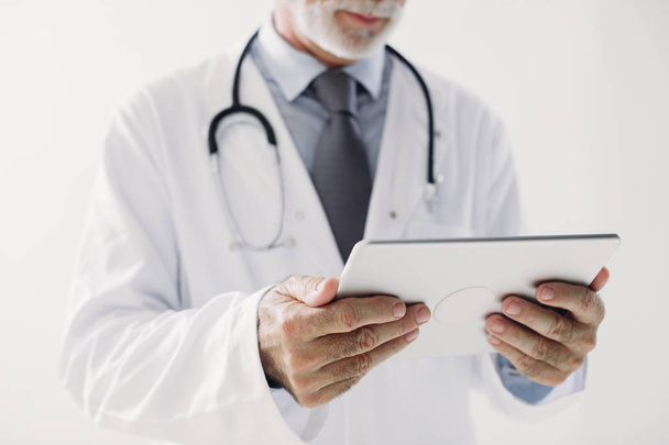 A Doctor Holding Tablet - Foto, Imagen