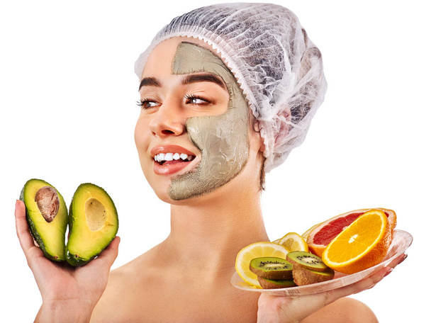 Mud facial mask of woman in spa salon. Face massage . - Photo, Image