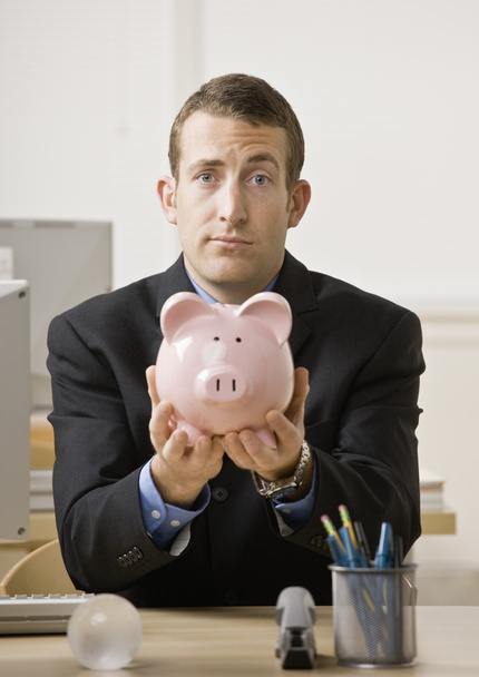 Young Businessman Holding Piggy Bank - Photo, Image