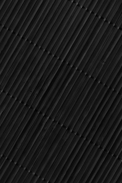 schwarze rustikale Bambus-Lattenrost-Platzmatte verflochten grobkörnige Grunge-Textur - Foto, Bild