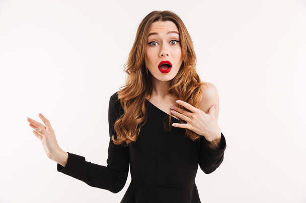 Shocked young woman isolated over white background - Φωτογραφία, εικόνα