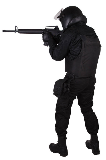 SWAT officer with assault rifle in black uniform - Valokuva, kuva