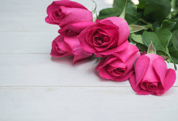 Pink rose on wooden background  - Photo, Image