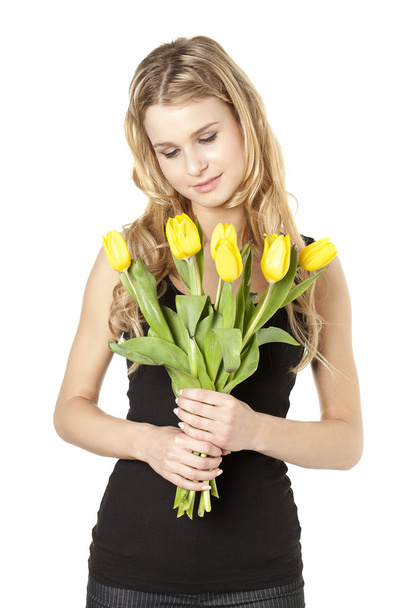 jovem mulher segurando flores de tulipa
 - Foto, Imagem