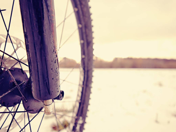 Mountain bike in powder snow. Lost path in snowdrift. Wheel detail - Photo, Image