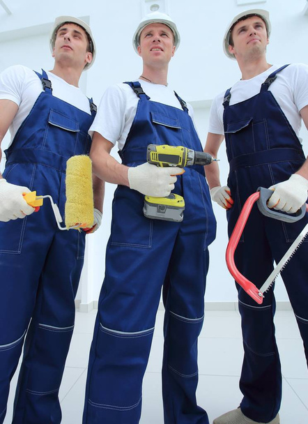 team of construction workers with working tools - Φωτογραφία, εικόνα