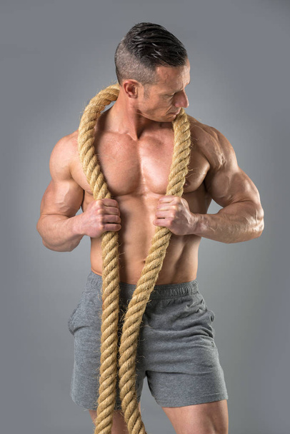 Powerful man with a rope - Photo, Image